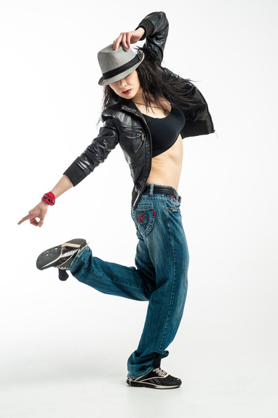 Brunett dancer. Woman dancing in a studio - Photo, image