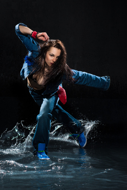 Wet dancing woman. Under waterdrops. Studio photo - Fotoğraf, Görsel