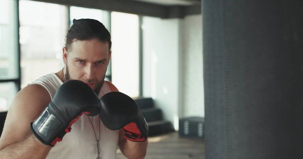 Sports and people, young male athlete training in boxing gym - Φωτογραφία, εικόνα