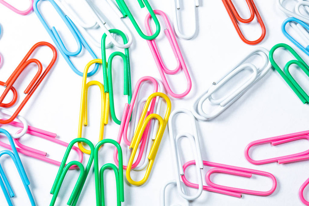 Colored office paper clips isolated on white - Фото, изображение