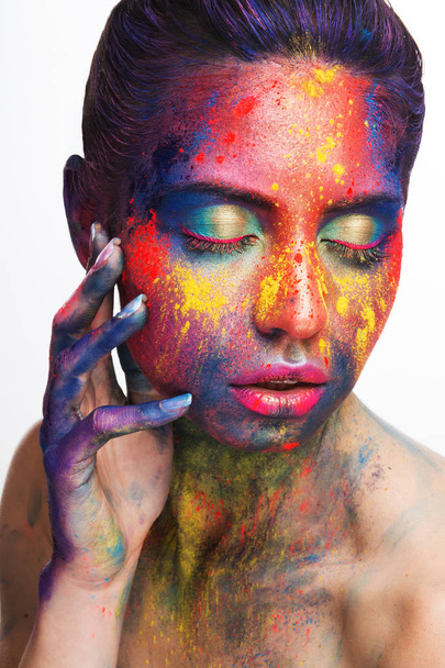 Beautiful woman with bright creative art makeup - Fotó, kép