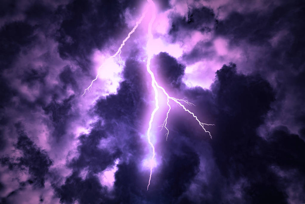 Lightning strike on the dark cloudy sky. - Photo, Image