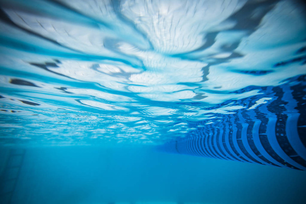 Wide angle underwater photo inside a swimming pool with racing lanes - Фото, зображення