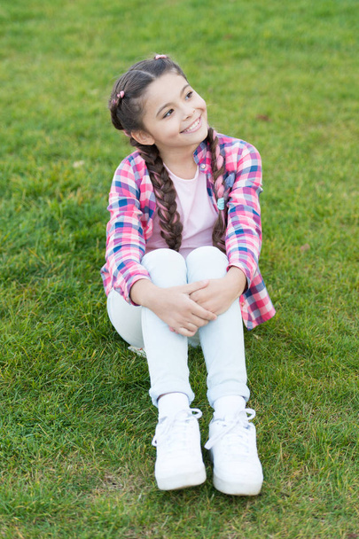 Day dreaming. Parks and outdoor. cheerful daydreamer. Spring nature. Summer picnic. Small school girl with trendy hair. happy childhood. small girl relax on green grass. Dreaming about vacation - Fotografie, Obrázek
