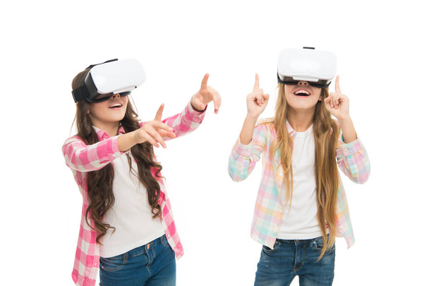 Play cyber game and study. Modern education. Alternative education technologies. Virtual education. Kids wear hmd explore virtual or augmented reality. Girls interact cyber reality. Game and fun - Photo, image