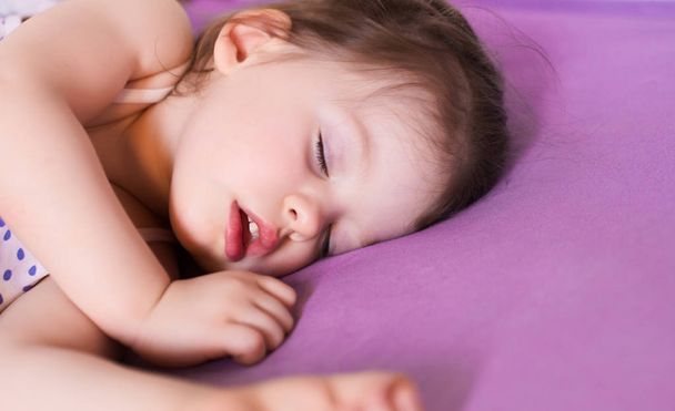 little cute baby sleeping soundly in her bed - Photo, image