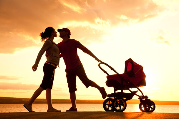 happy family walking on sunset - Fotó, kép