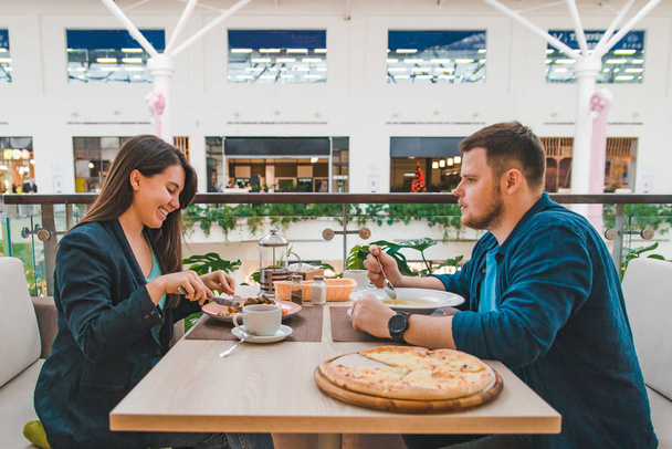 couple having lunch in mall cafe together. date talking - Photo, Image