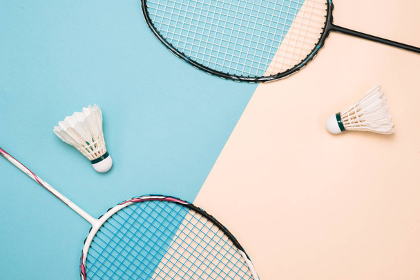 Shuttlecock and racket for playing badminton on a pastel color background. Minimalism. Concept summer - Fotó, kép