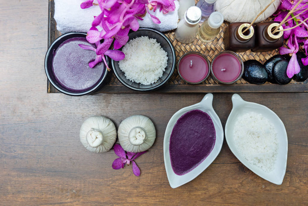 Thai Spa Treatments aroma therapy salt and nature sugar scrub and rock massage with orchid flower on wooden with candle. Thailand. Healthy Concept. - Fotó, kép