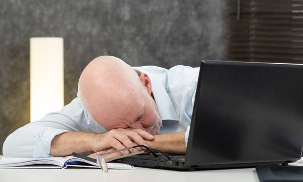 senior businessman is tired in the office - Photo, Image