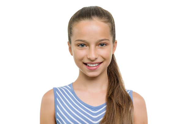 Portrait of beautiful girl of 10, 11 years old. Child with perfect white smile, isolated on white background - Foto, Imagen