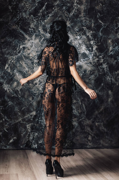 Sexy woman in lace black sensual robe and mask - Valokuva, kuva