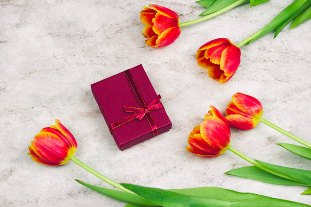 flat lay gift boxe  and tulips on a marble background - Foto, Imagem