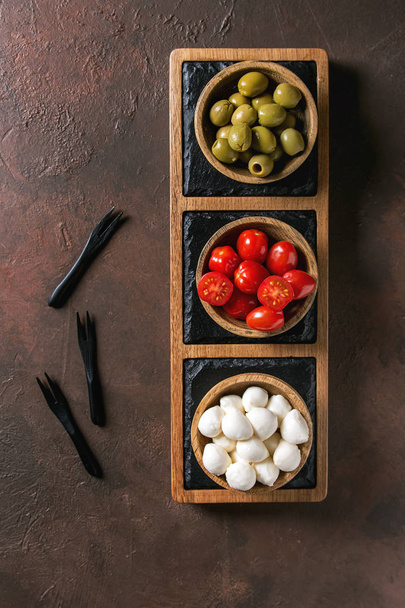 Mozzarella tomatoes olives antipasto - Photo, Image