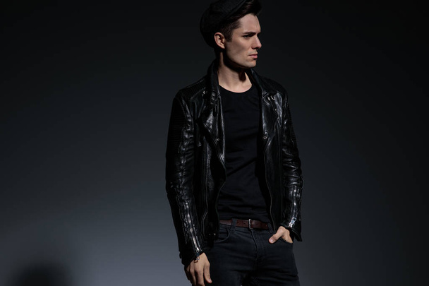 relaxed man in leather jacket stands and  dreams away - Photo, Image