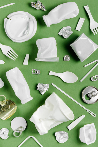Plastic waste collection on  green background. Concept of Recycling plastic and ecology. Flat lay, top view - Foto, Imagen