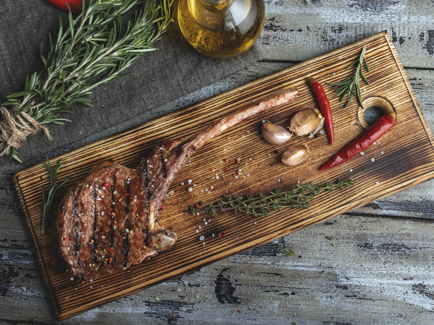 grilled lamb veal ribs loin on the on a cutting board, spices , chops - Photo, Image