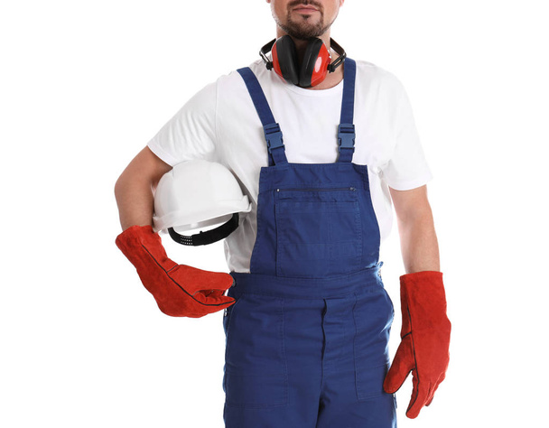 Male industrial worker in uniform on white background, closeup. Safety equipment - Zdjęcie, obraz