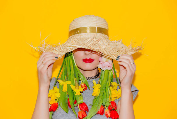 Woman in hat with tulips in hair  - Photo, Image