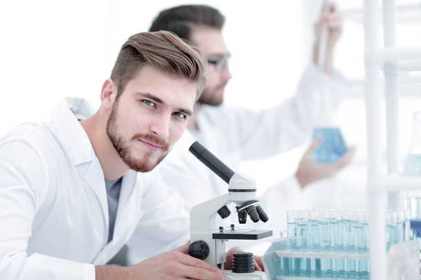 male researcher carrying out scientific research in a lab - Photo, Image