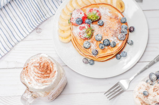 Healthy breakfast, coffee or cappuccino and homemade pancakes wi - Foto, Bild
