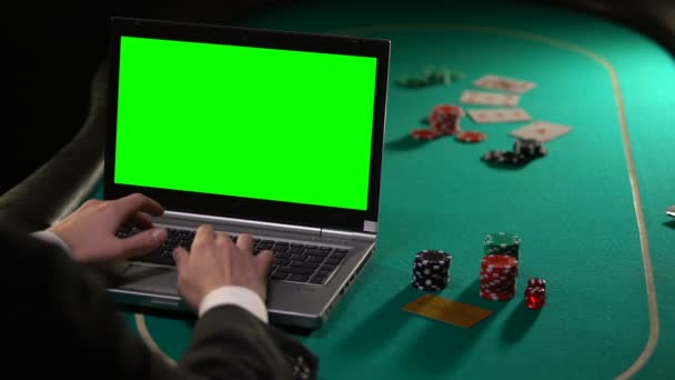 Vip client paying poker bets online with gold card, gambling sites, green screen - Felvétel, videó