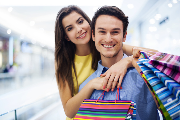 Happy young couple shopping - Photo, Image
