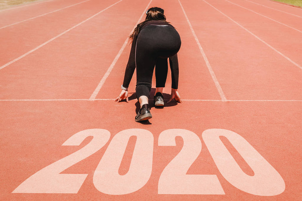 2020 Newyear , Athlete Woman starting on line for start running  - Fotoğraf, Görsel