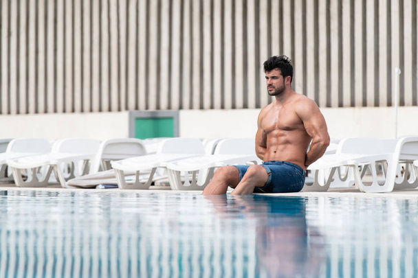 Young Looking Macho Man At Swimming Outdoor Pool - Fotoğraf, Görsel