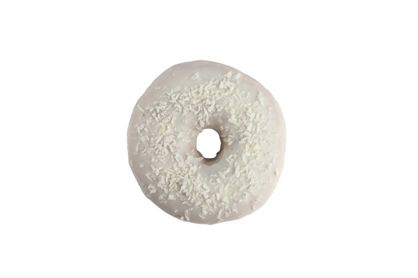 Appetizing donut in white glaze with the decoration of coconut chips on a white background. Isolated. - Valokuva, kuva