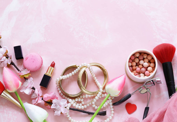 pink background with cosmetics and jewelry for women - Photo, image