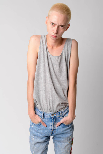 Portrait of young serious androgynous man looking at camera - Photo, Image