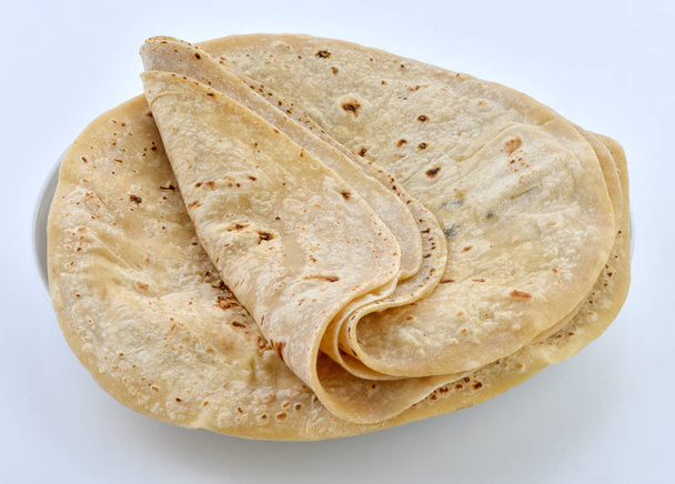 Chapati Rot o pan Chapati, una tortillas de harina de trigo fino, comida básica de los pueblos asiáticos
 - Foto, Imagen