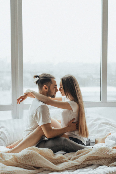   beautiful loving couple kissing in bed - Фото, зображення