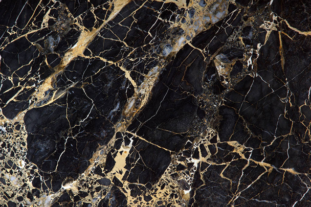 Black marble with beautiful yellow streaks, called New Portoro - Valokuva, kuva