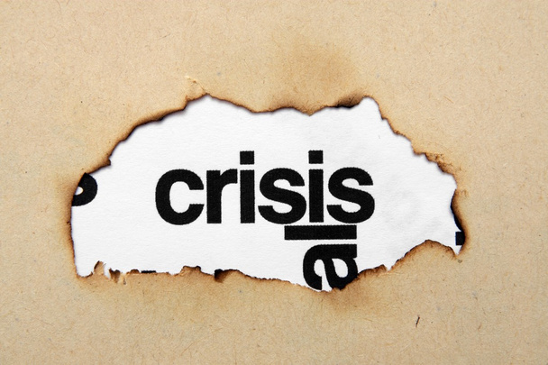crisis tekst op papier hole - Foto, afbeelding