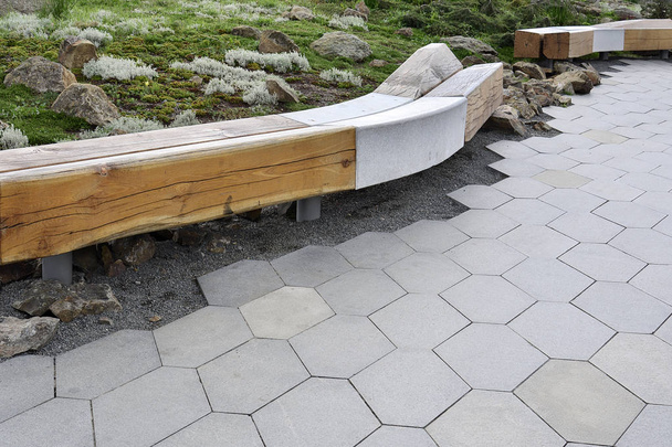 View of the alpine slide, undulating bench and pavement tiles in the park. - Photo, Image