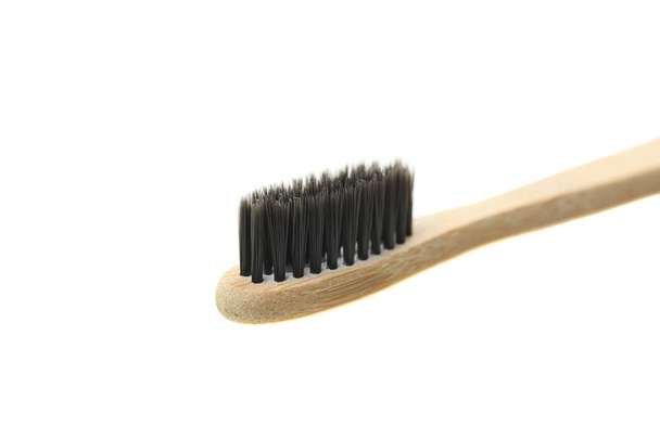 One natural organic reusable bamboo toothbrush  isolated on white. Concept zero waste. Clothe-up. - Φωτογραφία, εικόνα