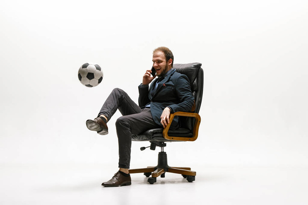 Businessman with football ball in office - Fotó, kép