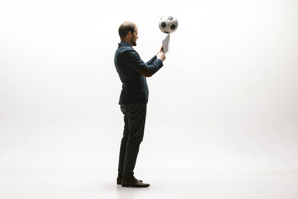 Businessman with football ball in office - Fotoğraf, Görsel