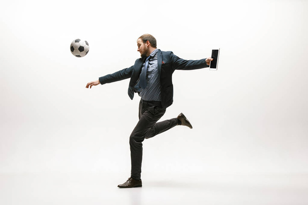 Businessman with football ball in office - Foto, immagini