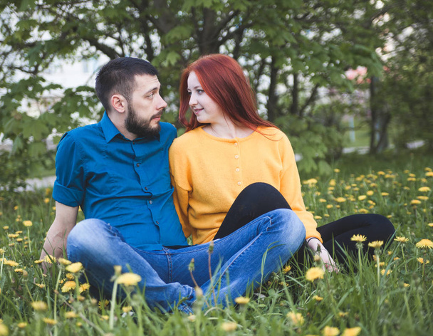 Portrait of   beautiful young couple in    park.  - Zdjęcie, obraz