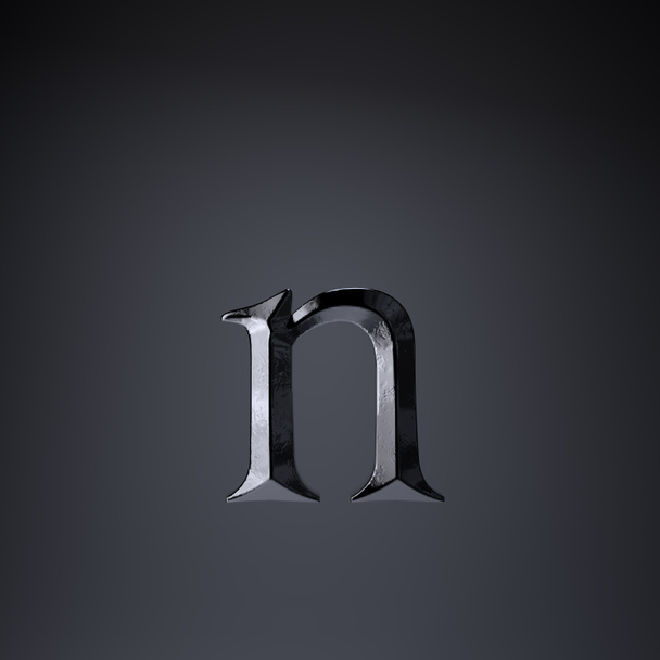 Gebeiteld ijzeren letter N kleine letters. 3D render spel of film titel lettertype geïsoleerd op zwarte achtergrond. - Foto, afbeelding