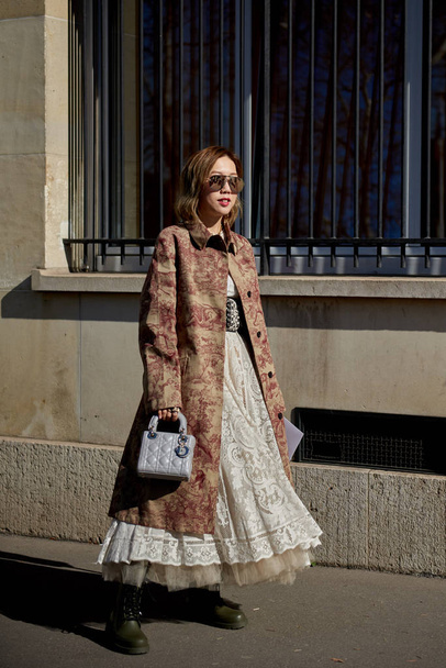 A trendy woman in fashionable outfit is pictured on the street during the Paris Fashion Week Fall/Winter 2019/2020 in Paris, France. - Fotografie, Obrázek