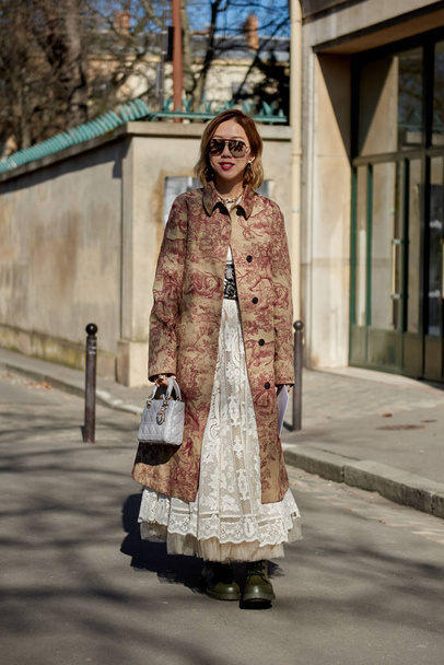 A trendy woman in fashionable outfit is pictured on the street during the Paris Fashion Week Fall/Winter 2019/2020 in Paris, France. - Fotoğraf, Görsel
