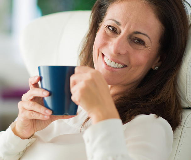 Happy Mature Woman Drinking Coffee - Photo, image