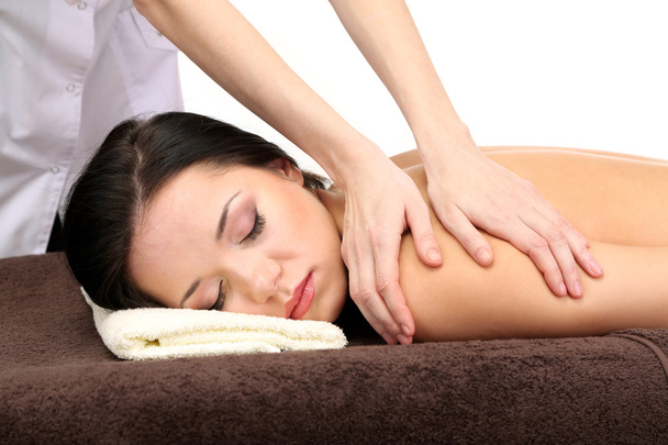 Beautiful young woman in spa salon getting massage, isolated on white - Φωτογραφία, εικόνα