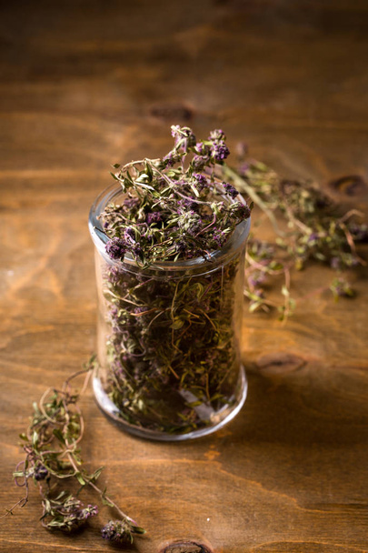 thyme in a glass jar, top view - Photo, Image