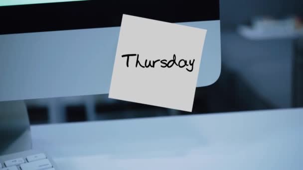 Thursday. Days of the week. The inscription on the sticker on the monitor. Message. Motivation. Reminder. Handwritten text written with a marker. Color sticker. A message for an employee, a colleague - Footage, Video